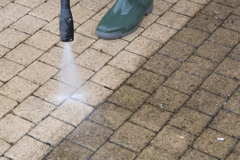 Cleaning a Plano Sidewalk Hot Water